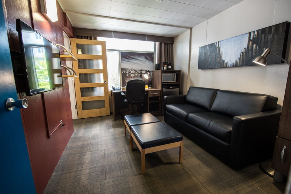 Room, 1 Queen Bed, Private Bathroom | Living area | TV