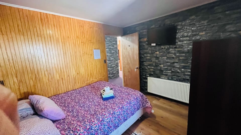 Premium bedding, desk, laptop workspace, blackout drapes