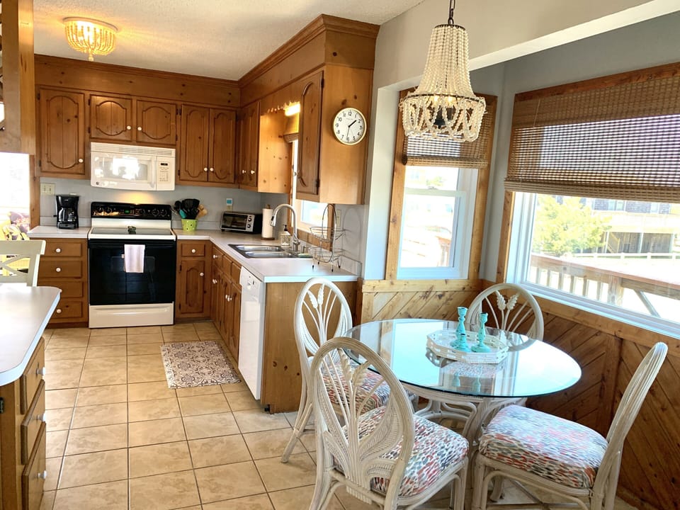 Large kitchen leads to sunporch. 