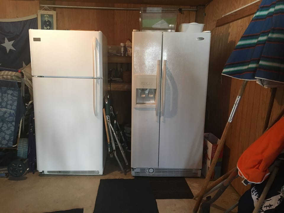 Additional refrigerator in laundry room.