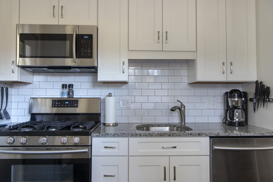 Coffee-maker & electric kettle w/complimentary coffee, tea cream & sweeteners.