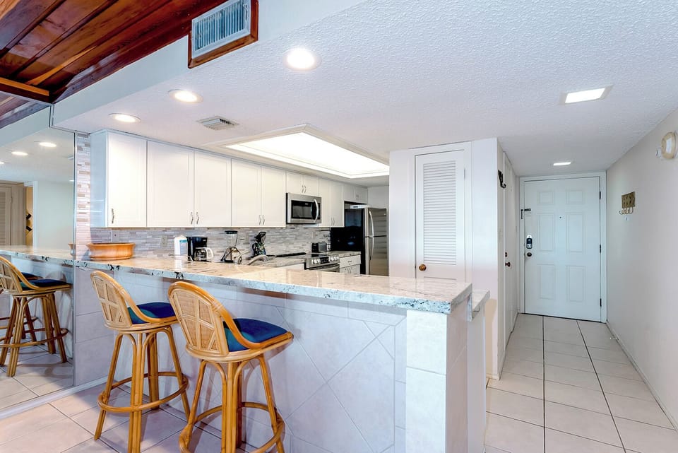 Your crew can gather around the kitchen bar while you prepare your summer favorites, keeping the fun flowing throughout the living space.