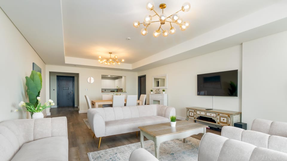 Luxury Apartment, 2 Bedrooms, Sea View (Palm View) | Living area | 55-inch Smart TV with cable channels