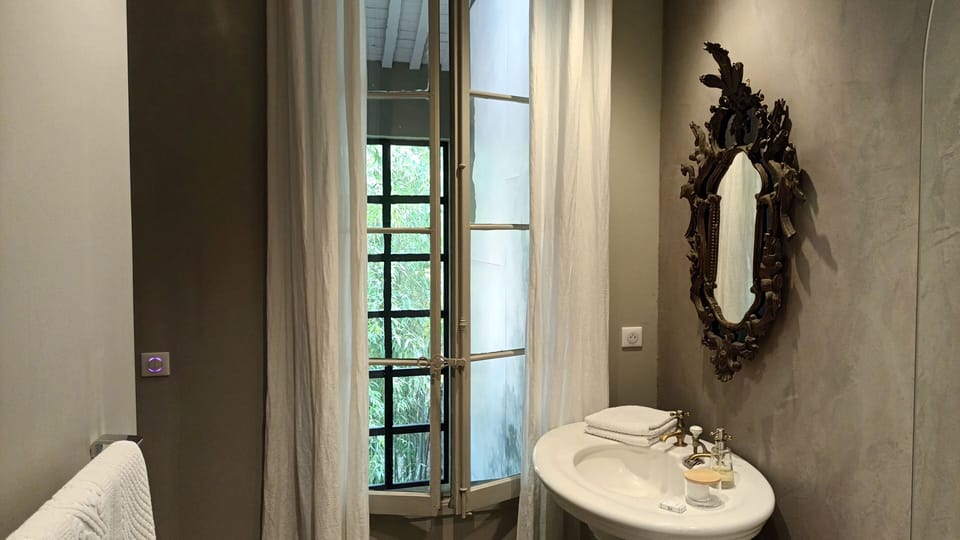 City House | Bathroom | Hair dryer, bathrobes, towels, soap