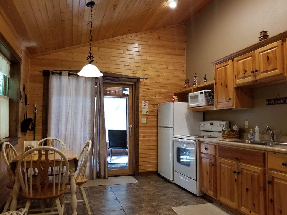 Fully equipped kitchen and table.