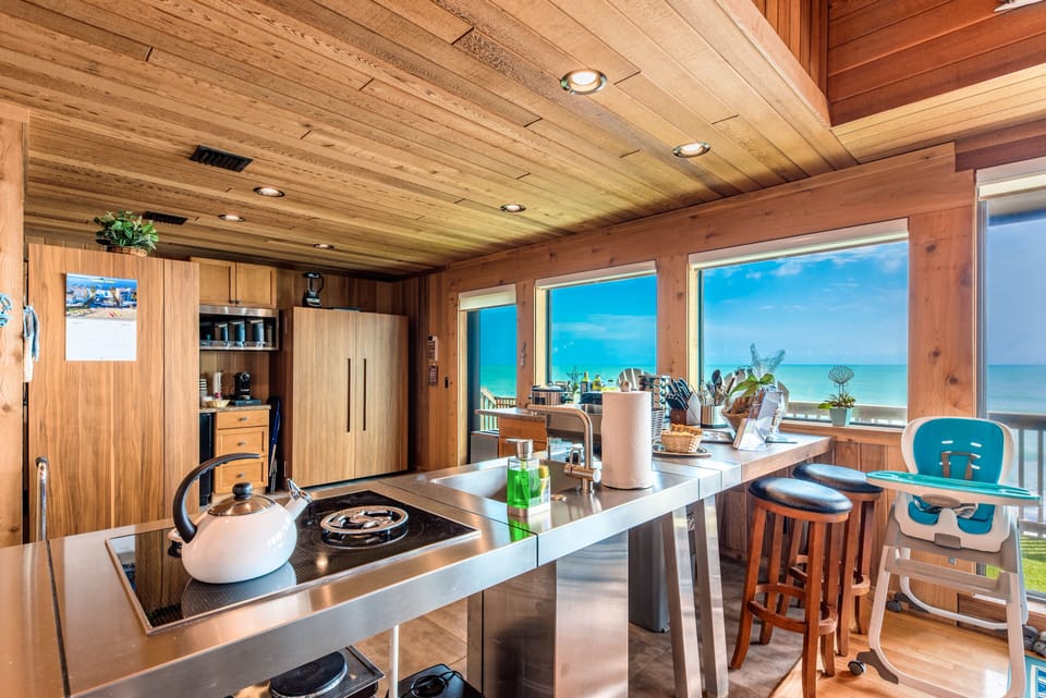 Restoration Sands: Scandinavian-style kitchen with hidden appliances