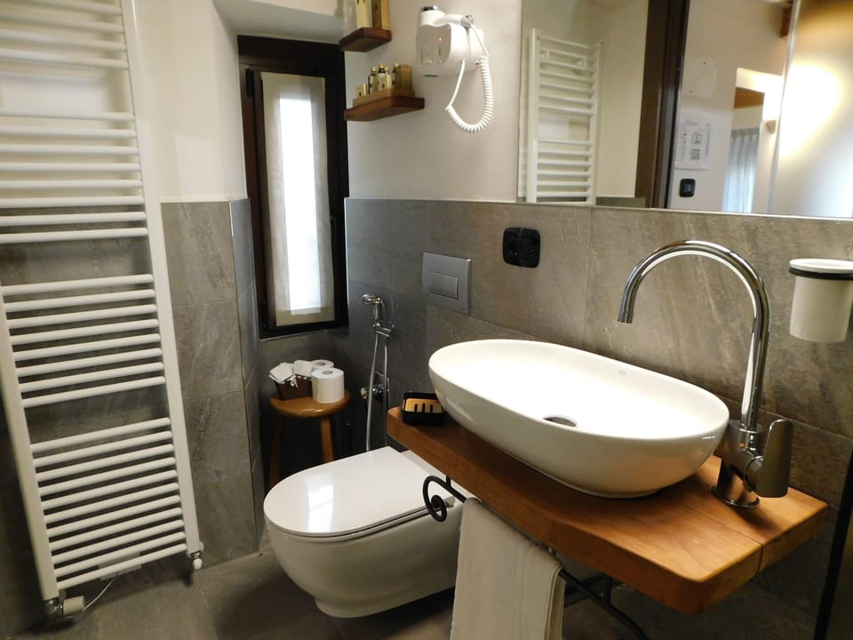 Shower, rainfall showerhead, hair dryer, towels