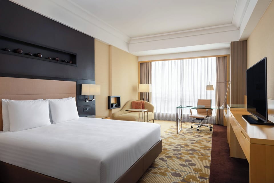 Premium bedding, free minibar items, in-room safe, desk