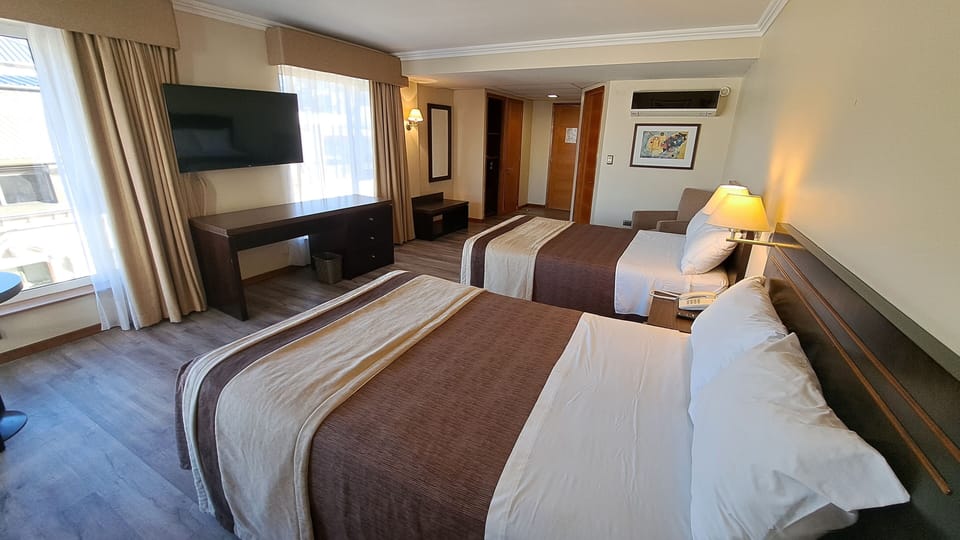 Double Room, City View | Minibar, in-room safe, desk, blackout drapes