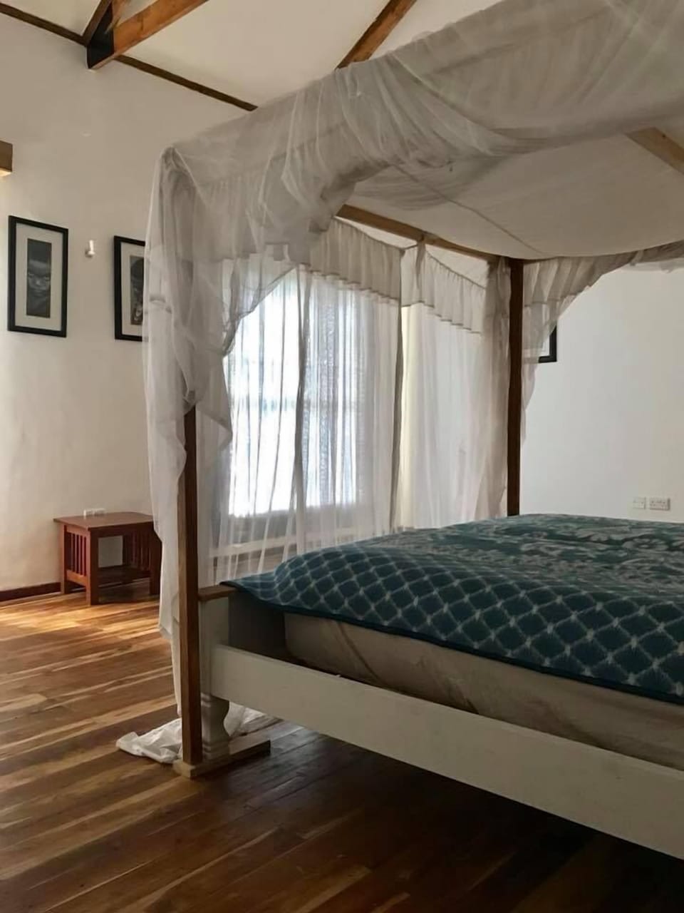 Desk, iron/ironing board, bed sheets