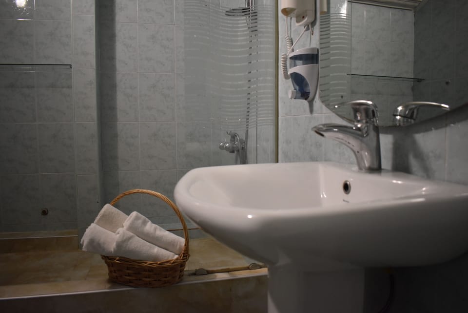 Standard Double Room, Balcony | Bathroom | Shower, free toiletries, hair dryer, slippers