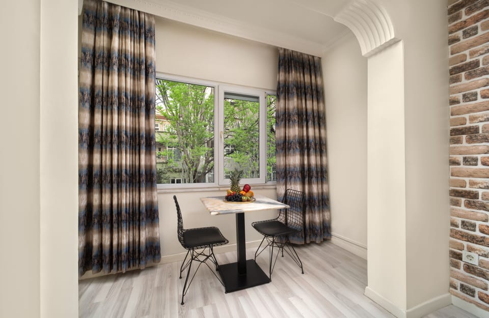 Superior Room | Living area | 40-inch Smart TV with satellite channels, Netflix, MP3 dock