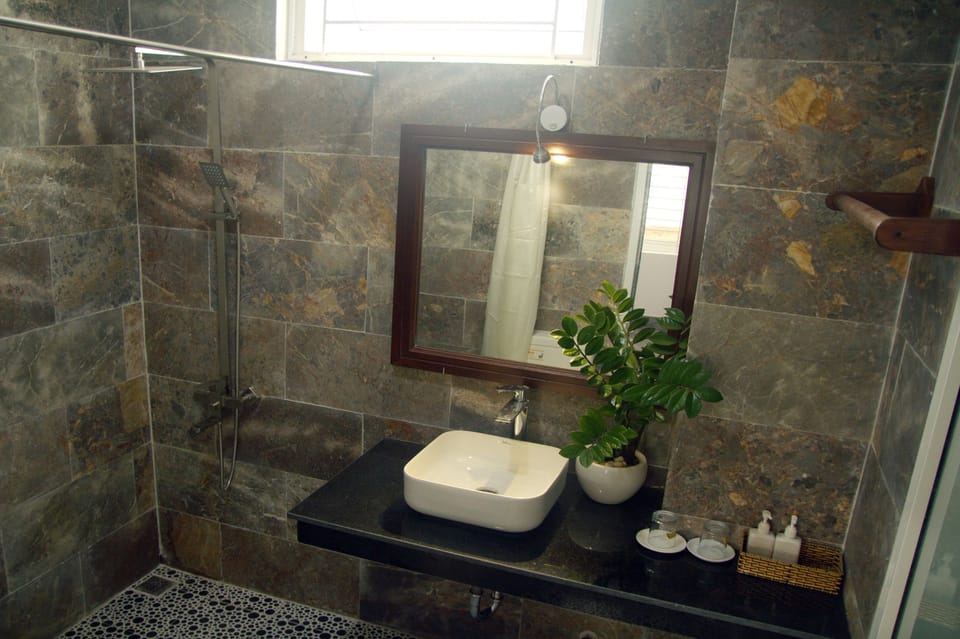 Shower, free toiletries, hair dryer, slippers
