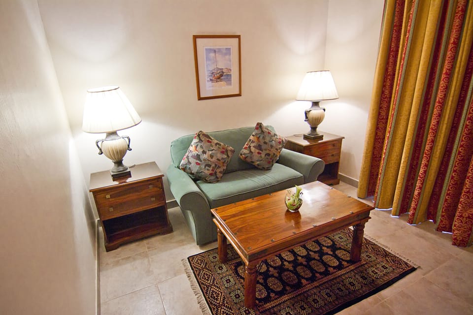 Village Junior Suite, 1 Bedroom, Pool View | Living room | 32-inch LCD TV with satellite channels, TV