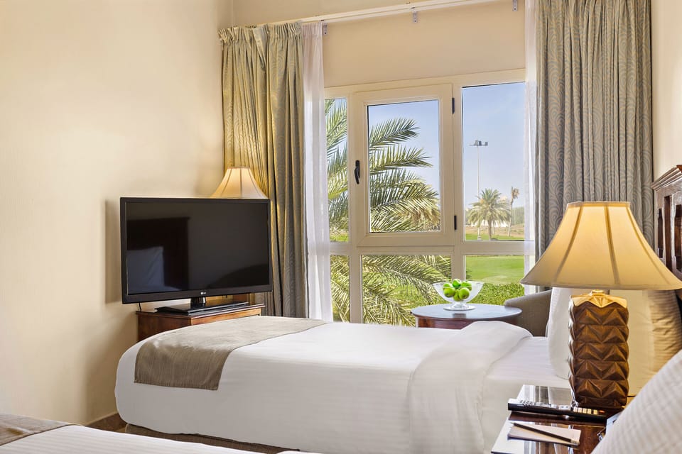 Classic Room | Minibar, in-room safe, individually furnished, desk