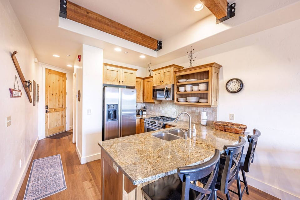The heart of any home is the kitchen. It's where memories are made and laughter is shared! The gorgeous kitchen is stocked with everything you could n