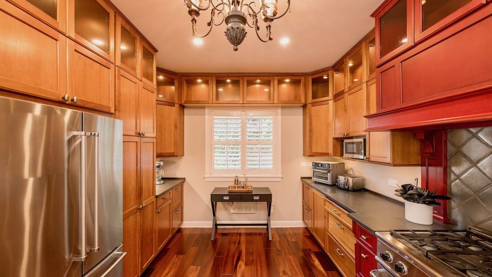 The fully equipped chef's kitchen features gourmet stainless steel appliances...