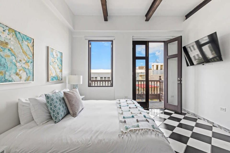 Suite features a king size bed and private balcony