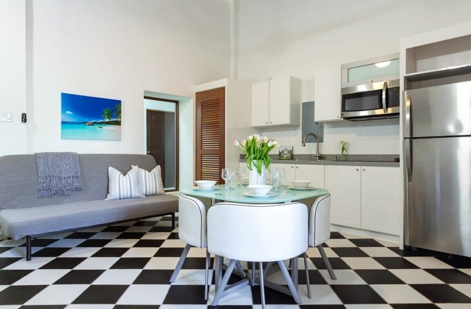 Living room, dining table and kitchen