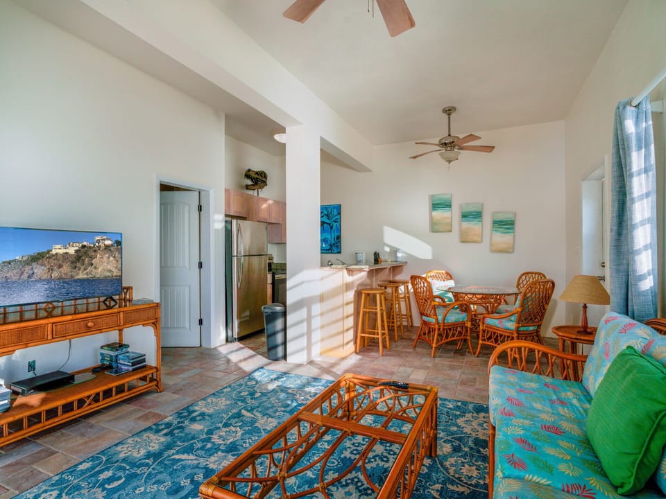The apartment suite`s living room with private deck, and a flat screen TV