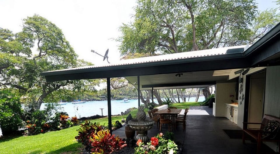 Watch the kayaks and paddle boarders while dining on the ocean-side lanai.