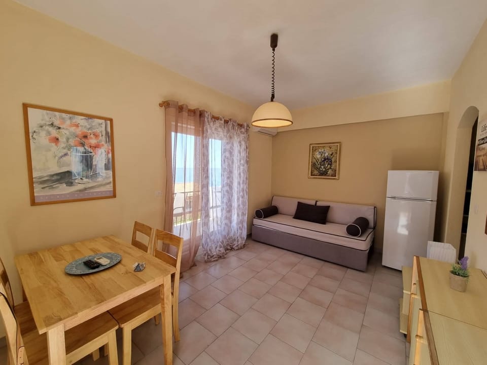 Apartment, 1 Bedroom, Sea View | Living area | TV