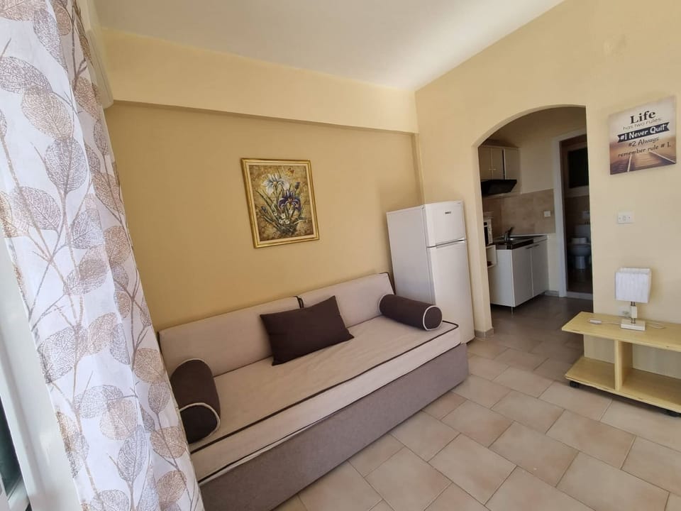 Apartment, 1 Bedroom, Sea View | Living area | TV