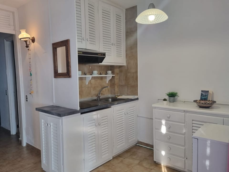 Apartment | Private kitchen | Fridge, stovetop, cookware/dishes/utensils