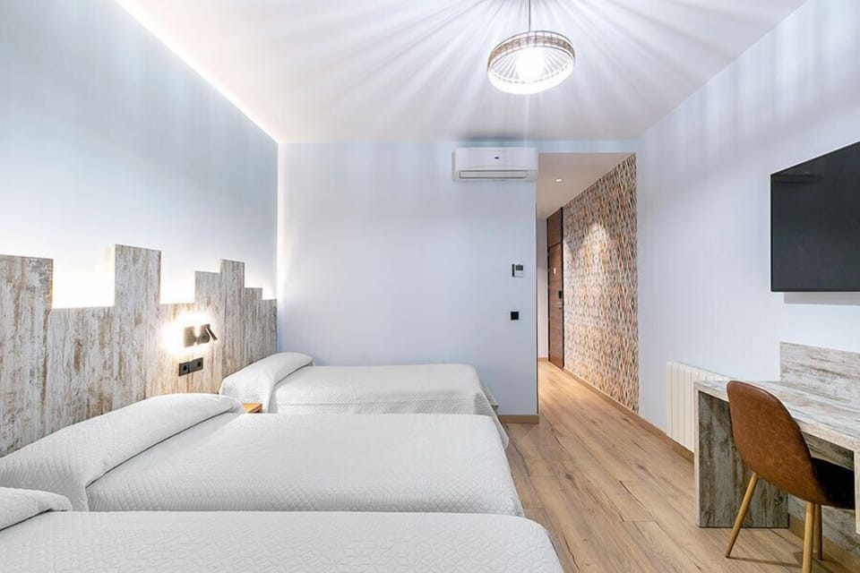 Triple Room | Down comforters, in-room safe, desk, soundproofing