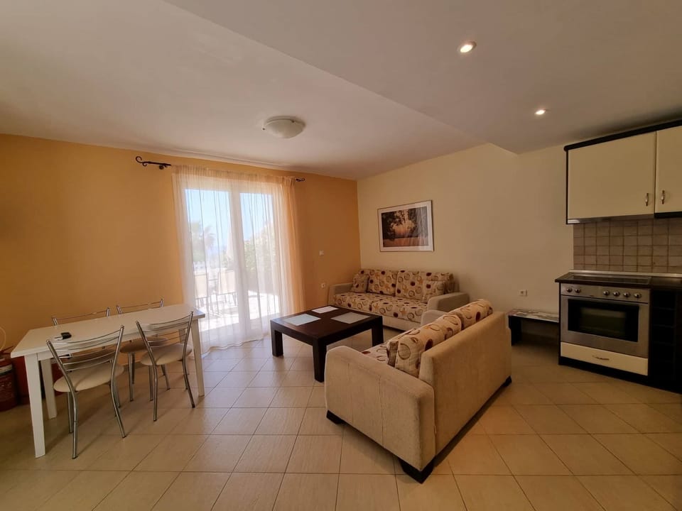 Apartment, 1 Bedroom | Living area | Flat-screen TV