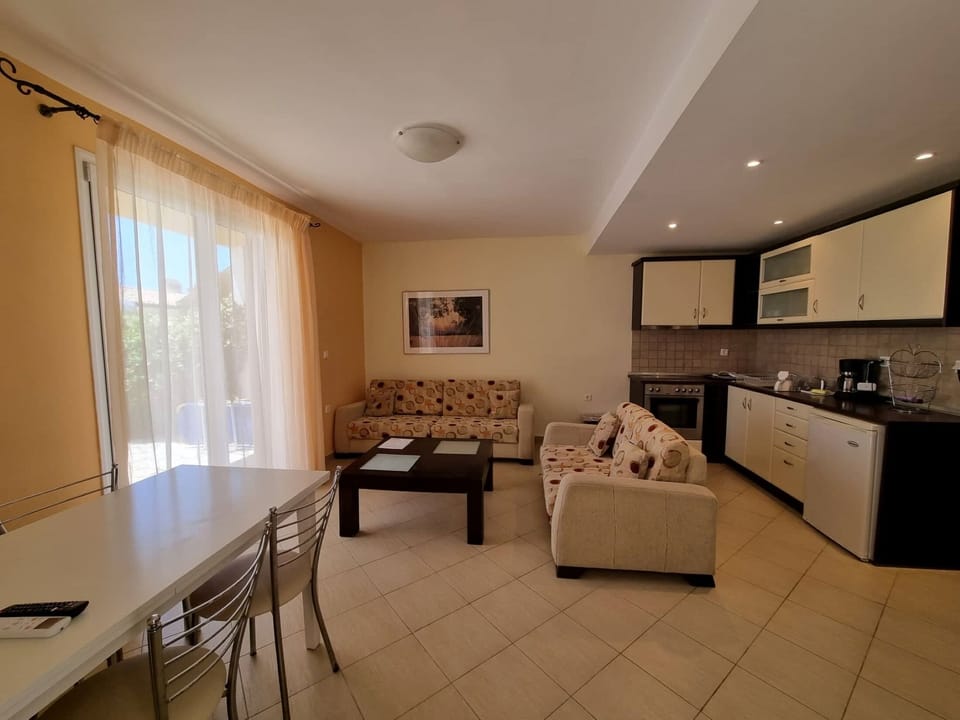 Apartment, 1 Bedroom | Living area | Flat-screen TV