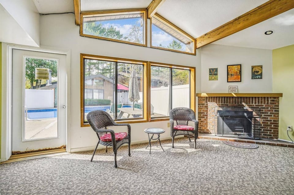 Hang out next the electric fireplace in the pool lounge