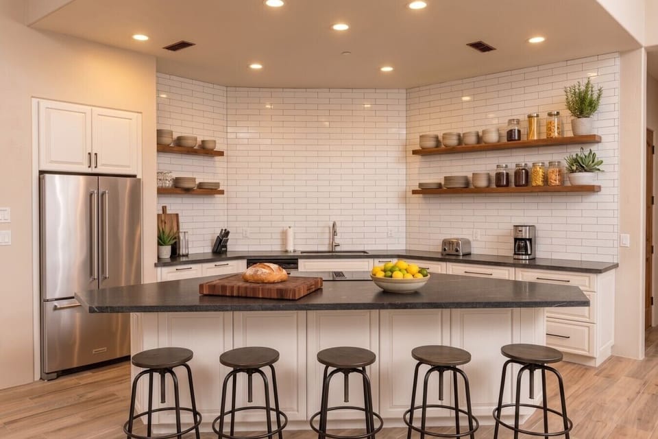 [Bar Area] Large bar & prep area with counter seating for 5 and full size fridge