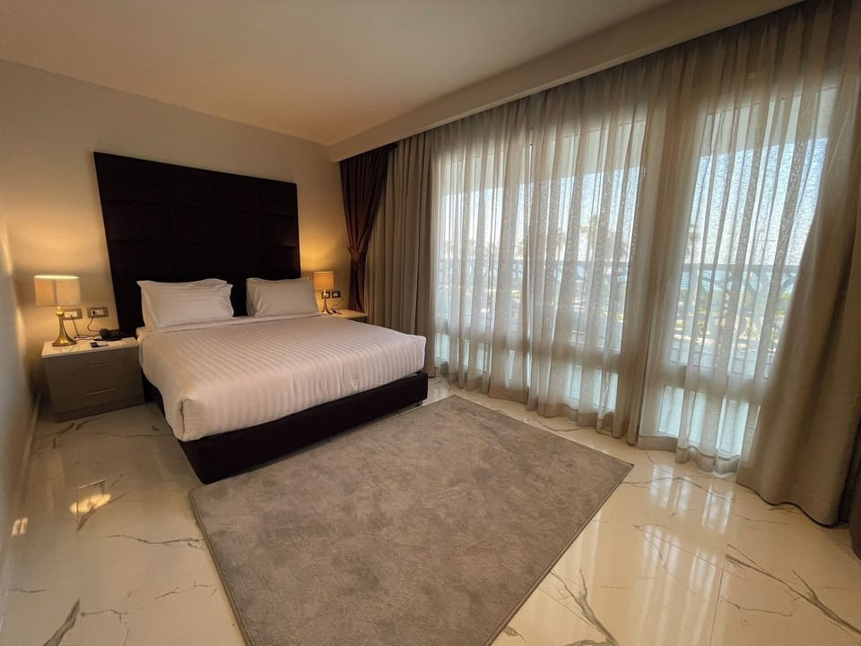 Family Double Room, Sea View | In-room safe, desk, laptop workspace, blackout drapes