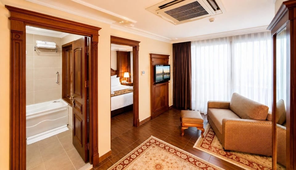 Executive Suite, Balcony, Sea View (King Bed with Sofabed) | Premium bedding, minibar, in-room safe, desk