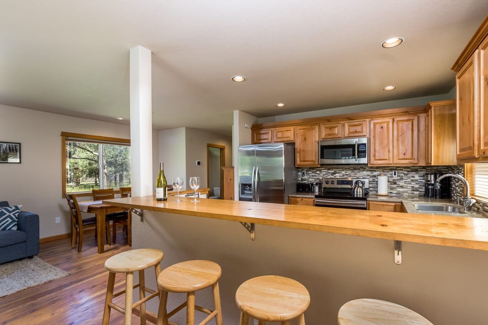Bar, kitchen, and dining area