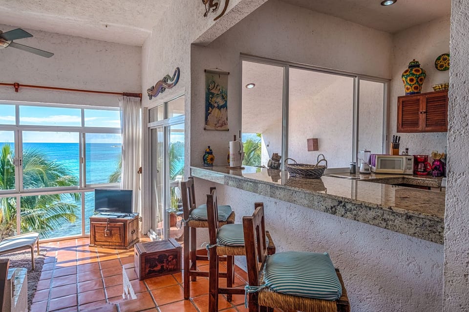 Interior kitchen/living area - La Sirena condo 13 Akumal Mexico vacation rental