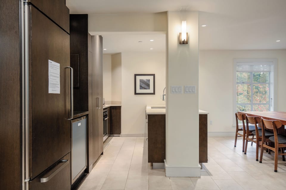 The full kitchen opens to the dining area.