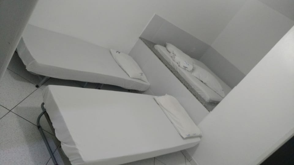 Economy Quadruple Room | Minibar, blackout drapes, bed sheets