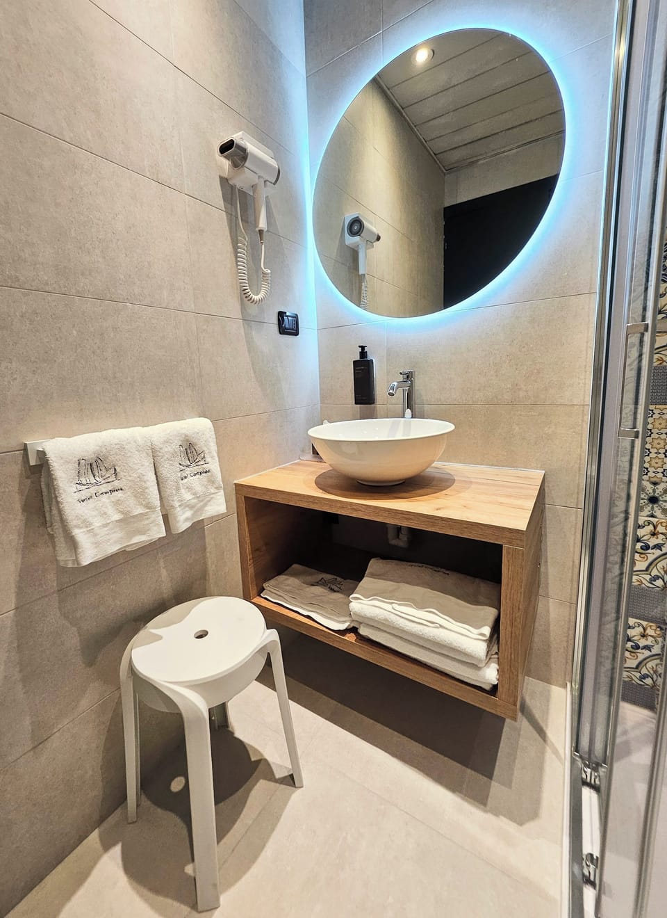 Shower, free toiletries, hair dryer, slippers