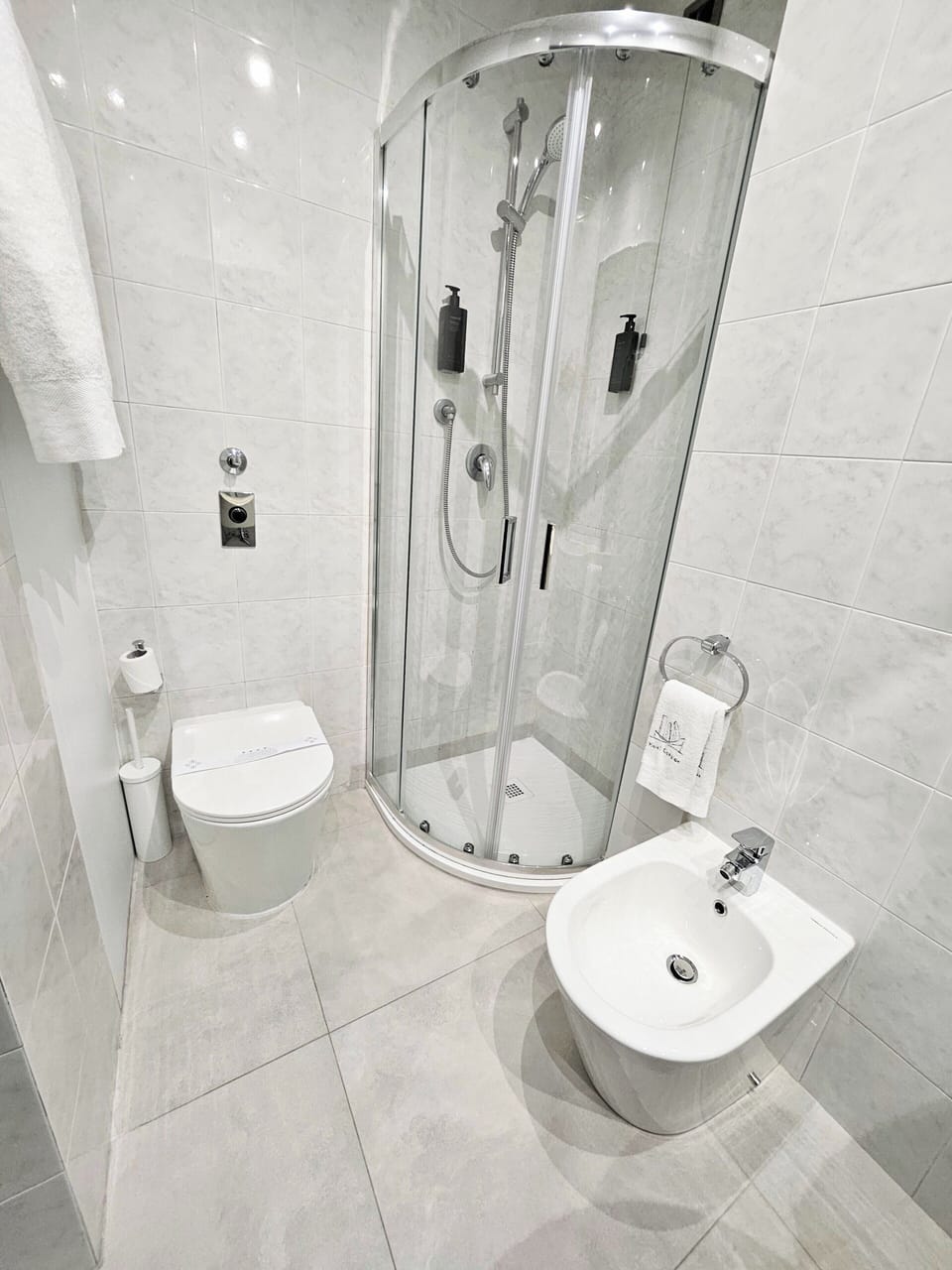 Shower, free toiletries, hair dryer, slippers