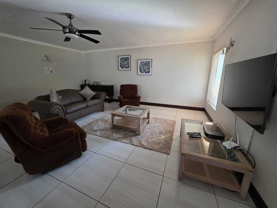 Superior Double Room | Living area | 55-inch TV with cable channels, fireplace