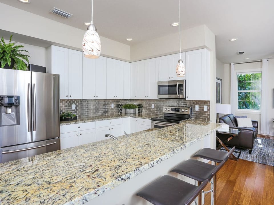 Kitchen island has additional seating for 4