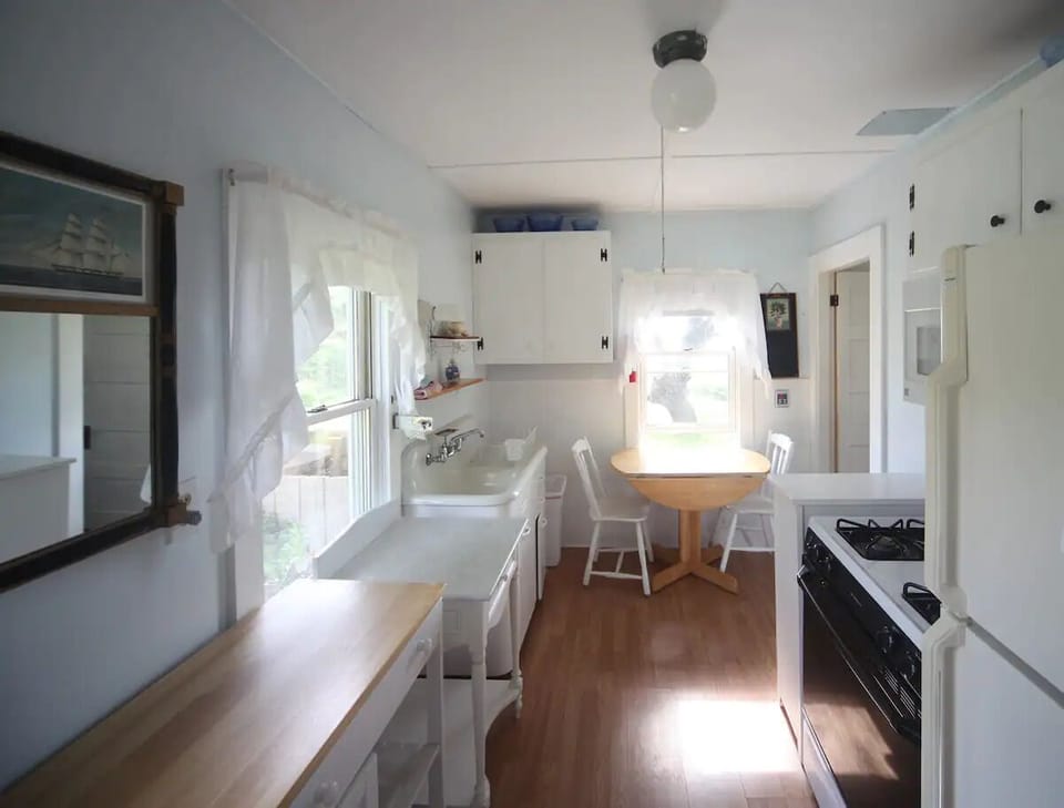 Kitchen with full sized frig, stove, microwwave