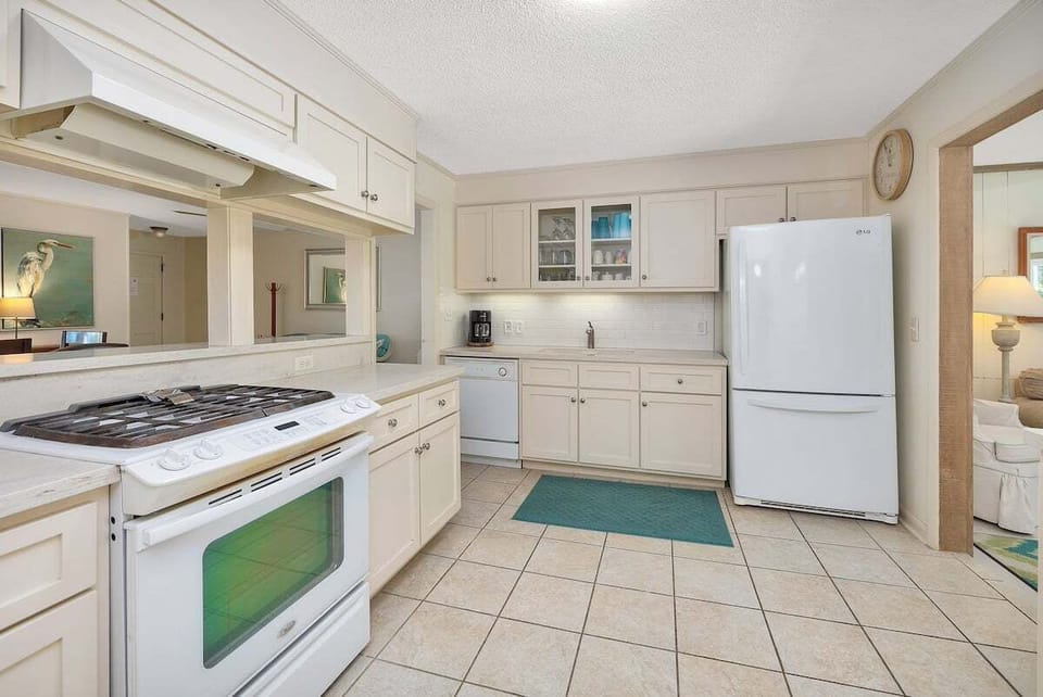 Kitchen area showing appliances and cabinets