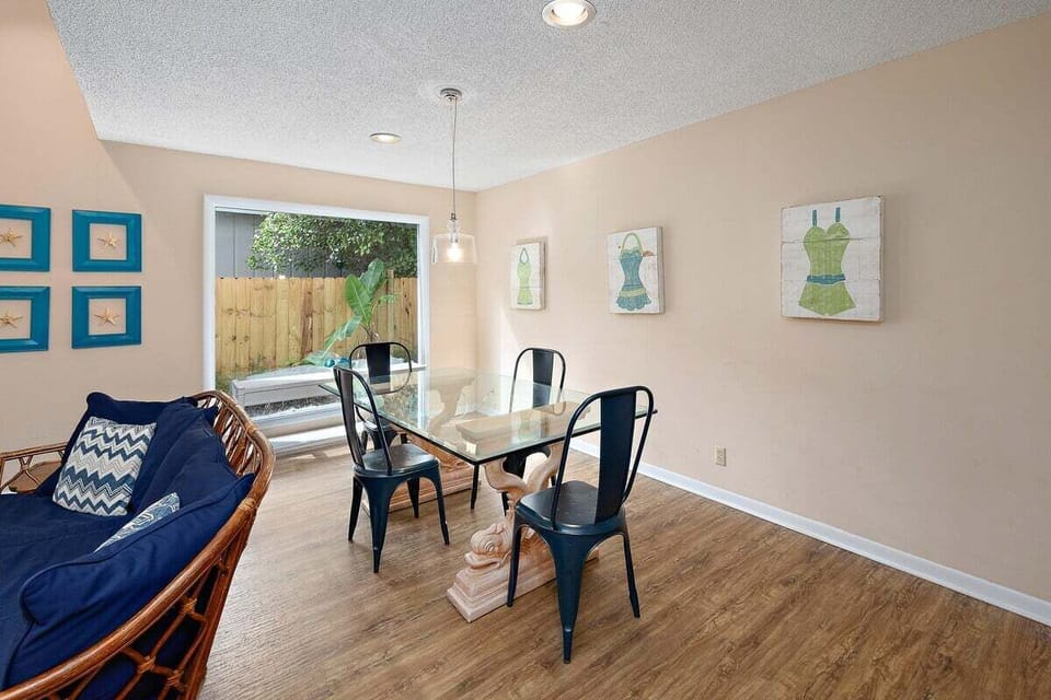 Dining table with seating for four under pendant lighting