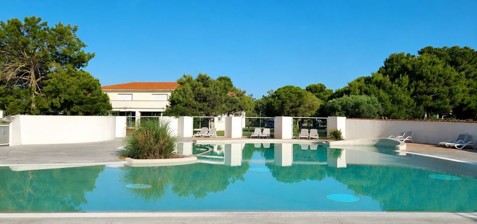 Relax in the pool while listening to the cicadas sing.