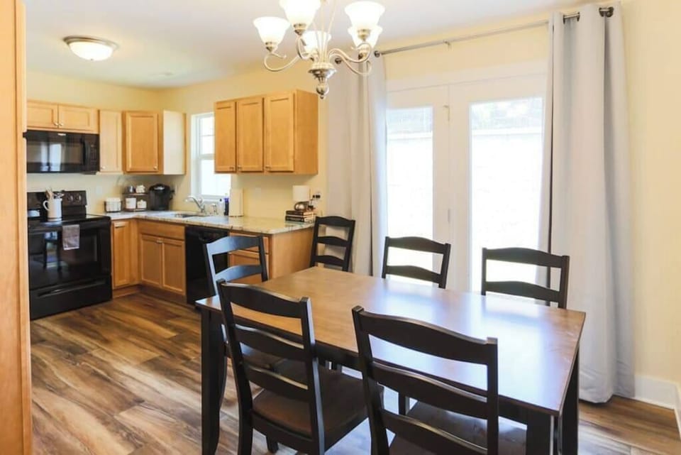 A big kitchen table with enough spaces for everyone to enjoy a meal or board game together!