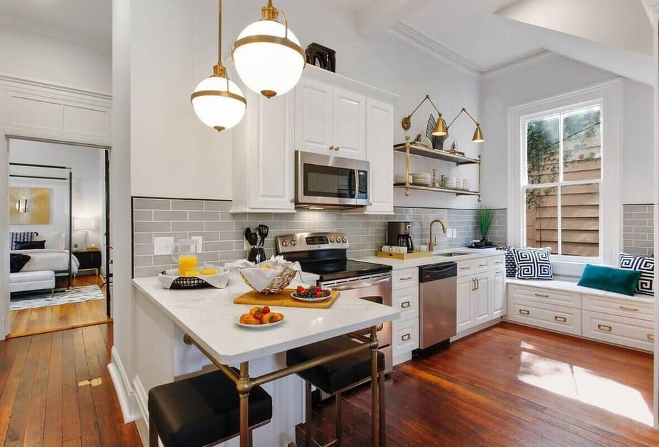 Kitchen | Fully Stocked Kitchen with Natural Light | First Floor of Building — Unit on One Level