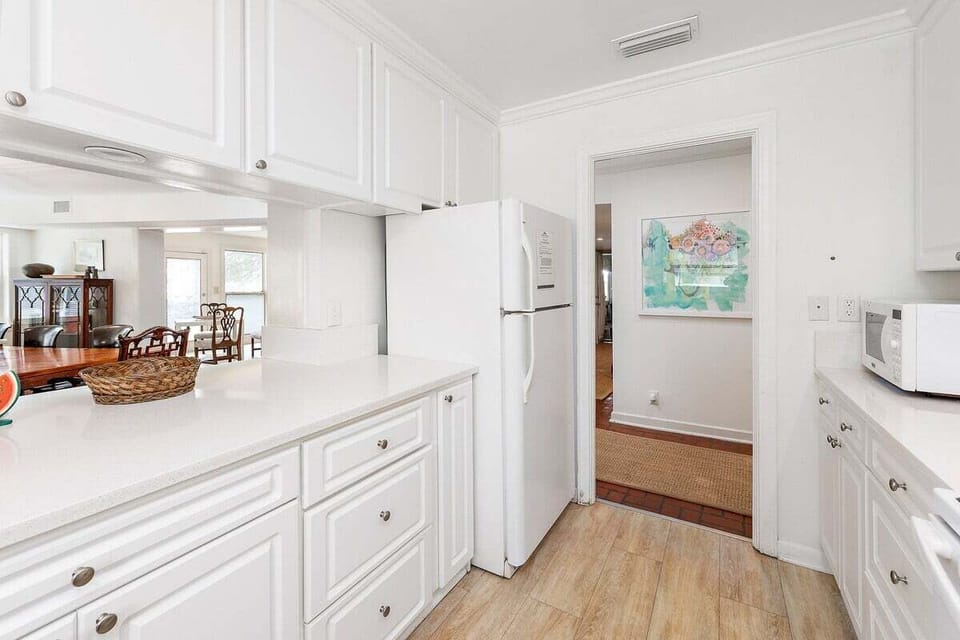 Alternate view of kitchen with view of the dining space